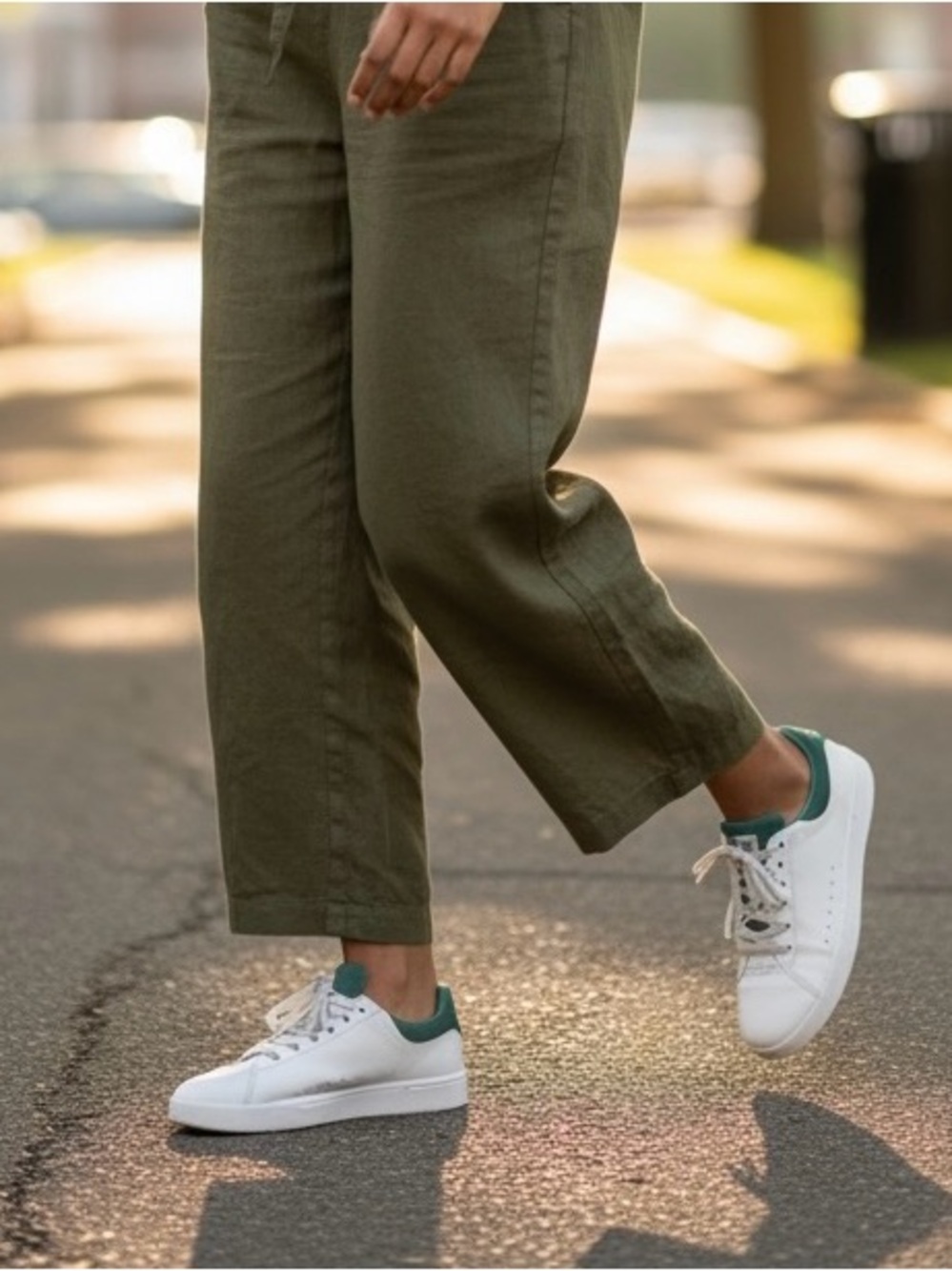On Running White Sneakers with Green Collar